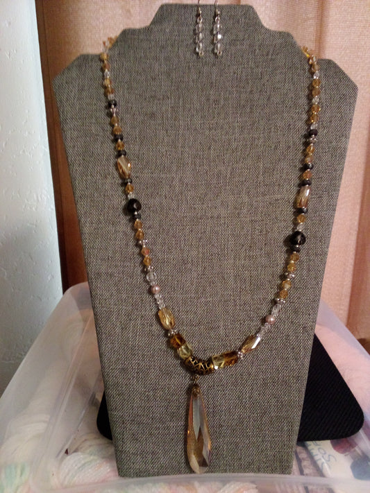 Long topaz necklace with long crystal colored topaz.